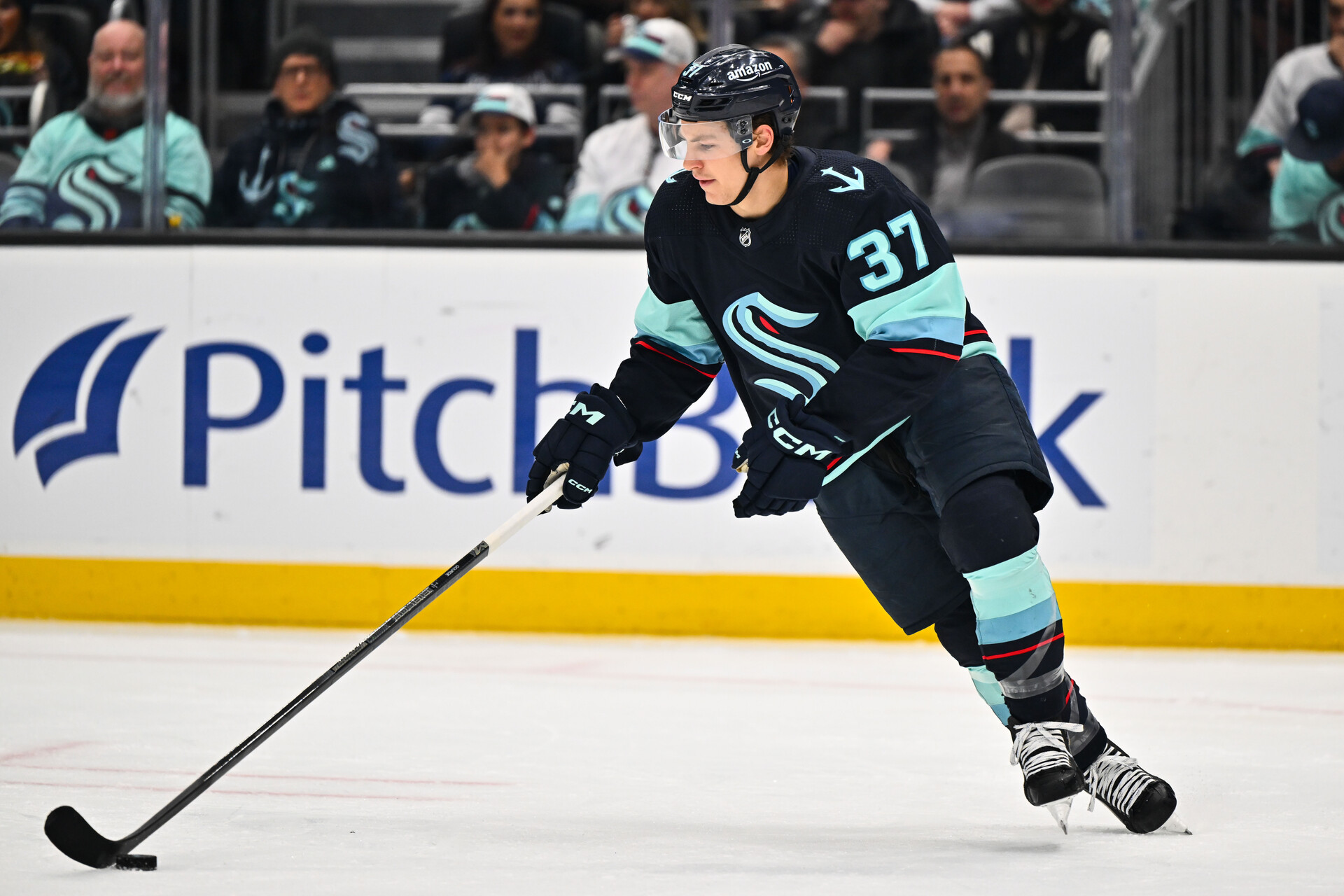 Feb 26, 2023; Seattle, Washington, USA; Seattle Kraken center Yanni Gourde (37) advances the puck during the first period at Climate Pledge Arena. Toronto defeated Seattle 5-1.