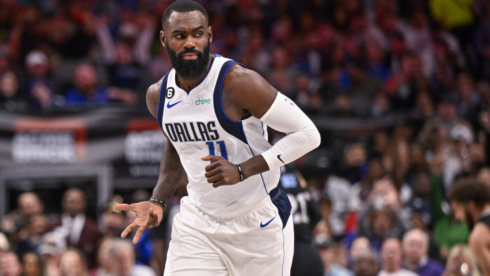 Dallas Mavericks forward Tim Hardaway Jr. (11) celebrates after he makes a three point basket against the Memphis Grizzlies during the second quarter at the American Airlines Center.
