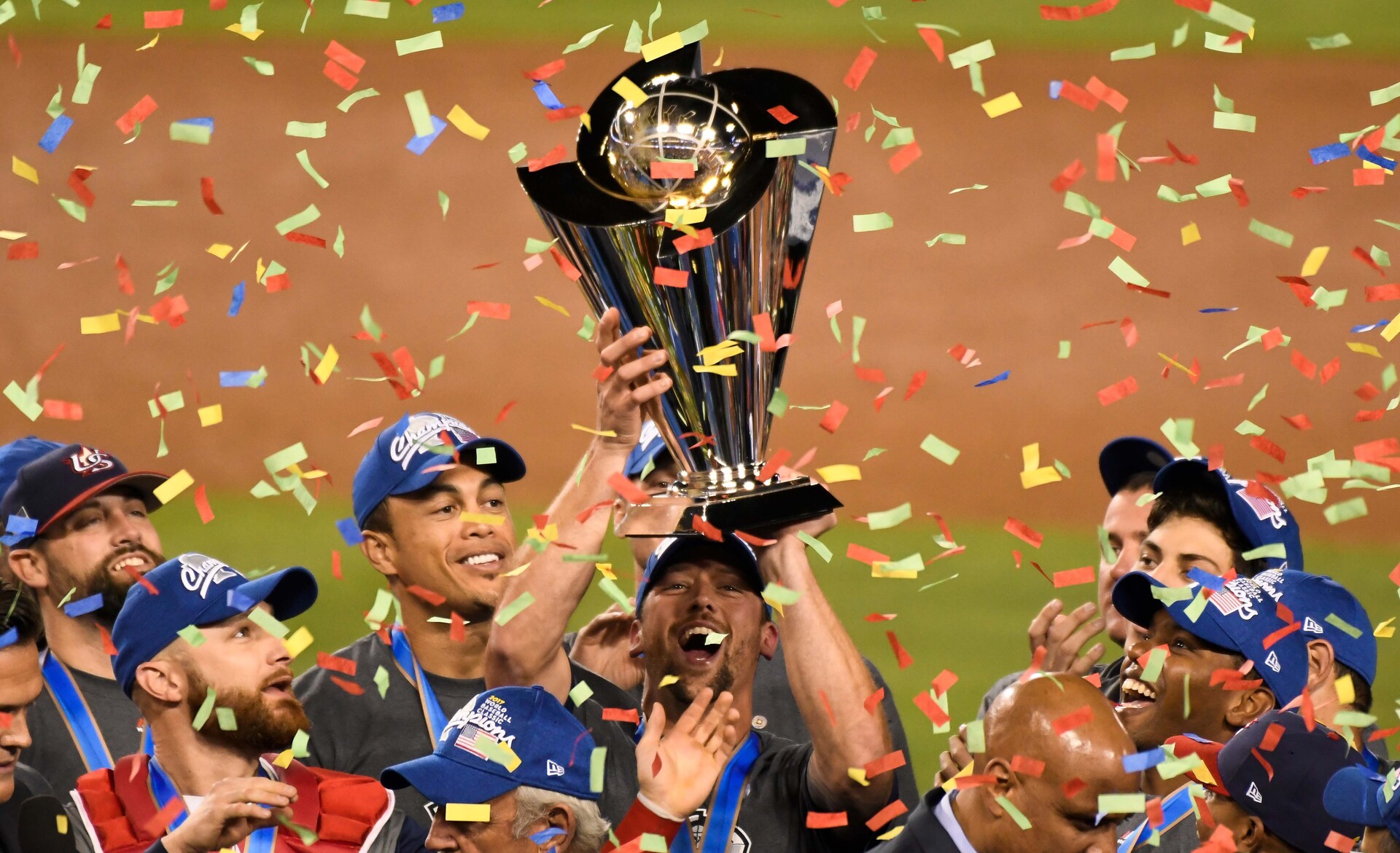United State players hold up the championship trophy after defeating Puerto Rico in the final of the 2017 World Baseball Classic at Dodger Stadium.