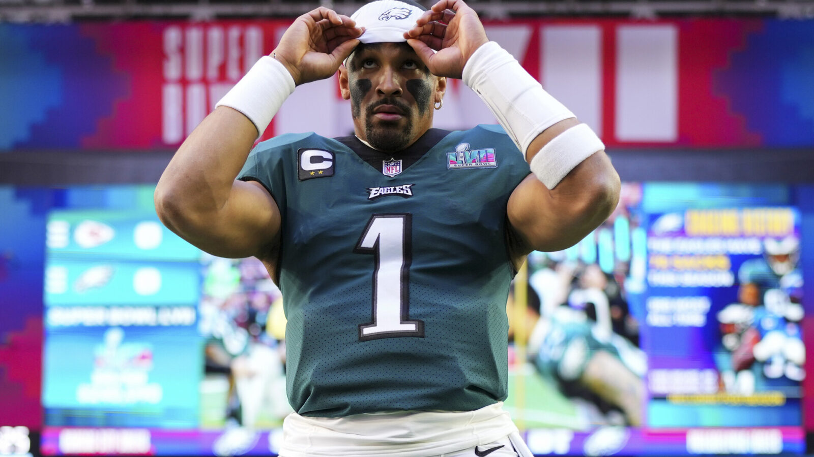 Jalen Hurts #1 of the Philadelphia Eagles adjusts his headband against the Kansas City Chiefs prior to Super Bowl LVII at State Farm Stadium on February 12, 2023 in Glendale, Arizona.