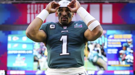 Jalen Hurts #1 of the Philadelphia Eagles adjusts his headband against the Kansas City Chiefs prior to Super Bowl LVII at State Farm Stadium on February 12, 2023 in Glendale, Arizona.