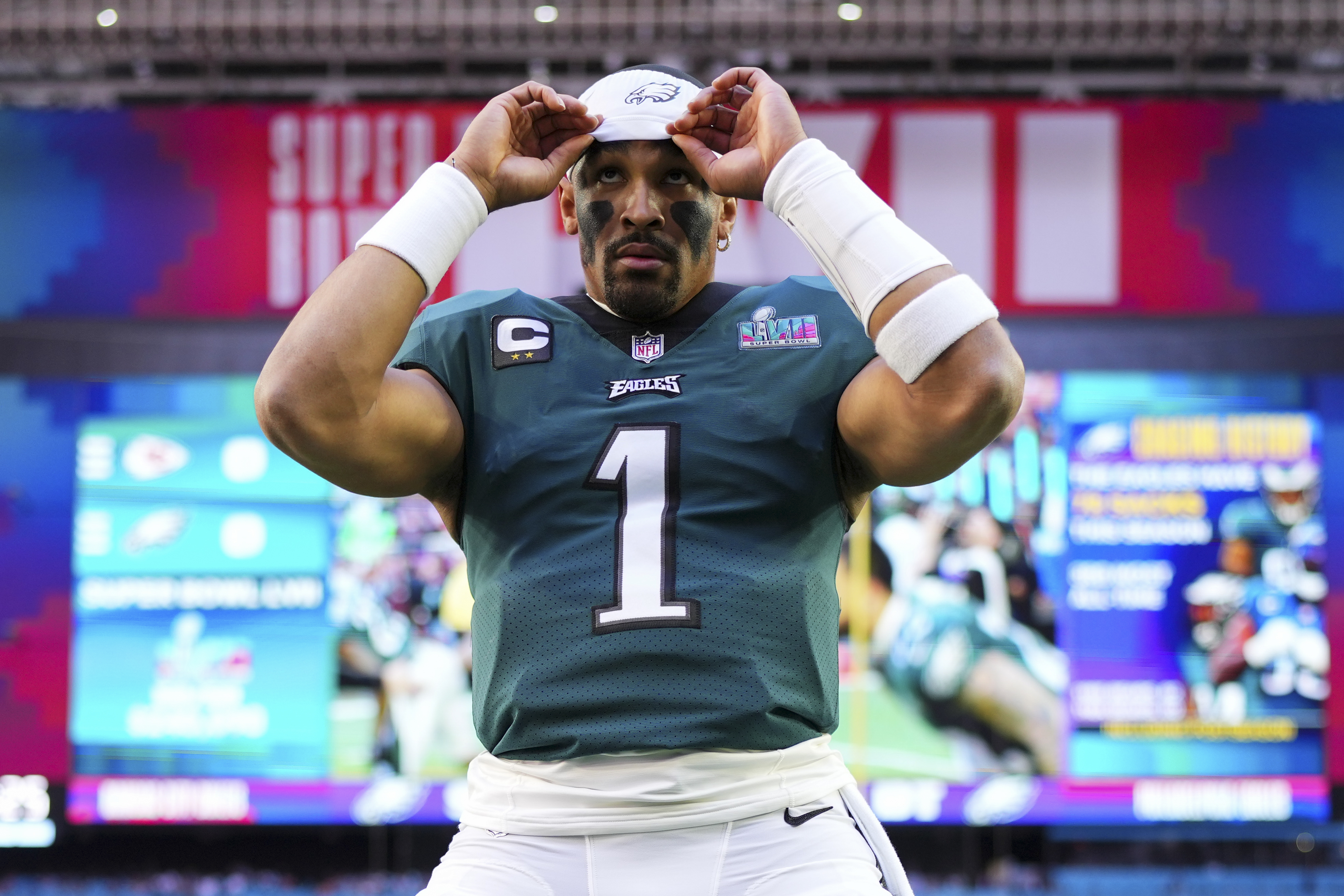 Jalen Hurts #1 of the Philadelphia Eagles adjusts his headband against the Kansas City Chiefs prior to Super Bowl LVII at State Farm Stadium on February 12, 2023 in Glendale, Arizona.