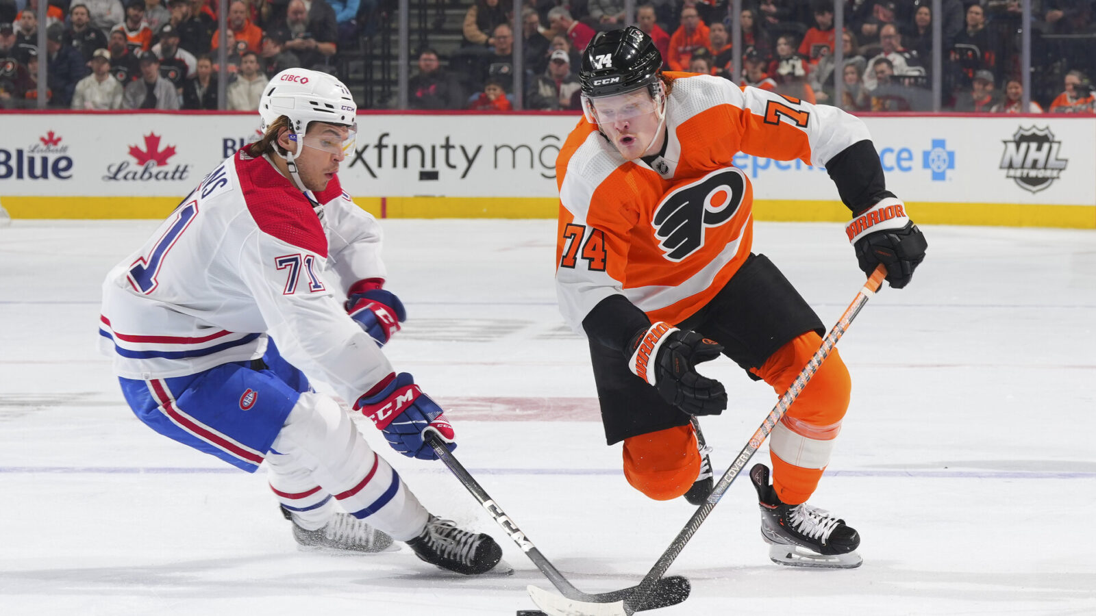 PHILADELPHIA, PA - MARCH 28: Jake Evans #71 of the Montreal Canadiens battles with Owen Tippett #74 of the Philadelphia Flyers in the second period at the Wells Fargo Center on March 28, 2023 in Philadelphia, Pennsylvania. (Photo by