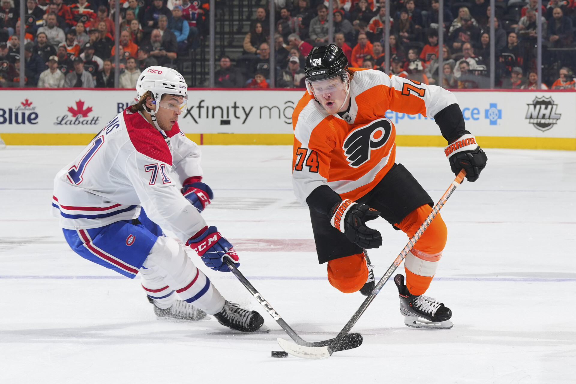 PHILADELPHIA, PA - MARCH 28: Jake Evans #71 of the Montreal Canadiens battles with Owen Tippett #74 of the Philadelphia Flyers in the second period at the Wells Fargo Center on March 28, 2023 in Philadelphia, Pennsylvania. (Photo by