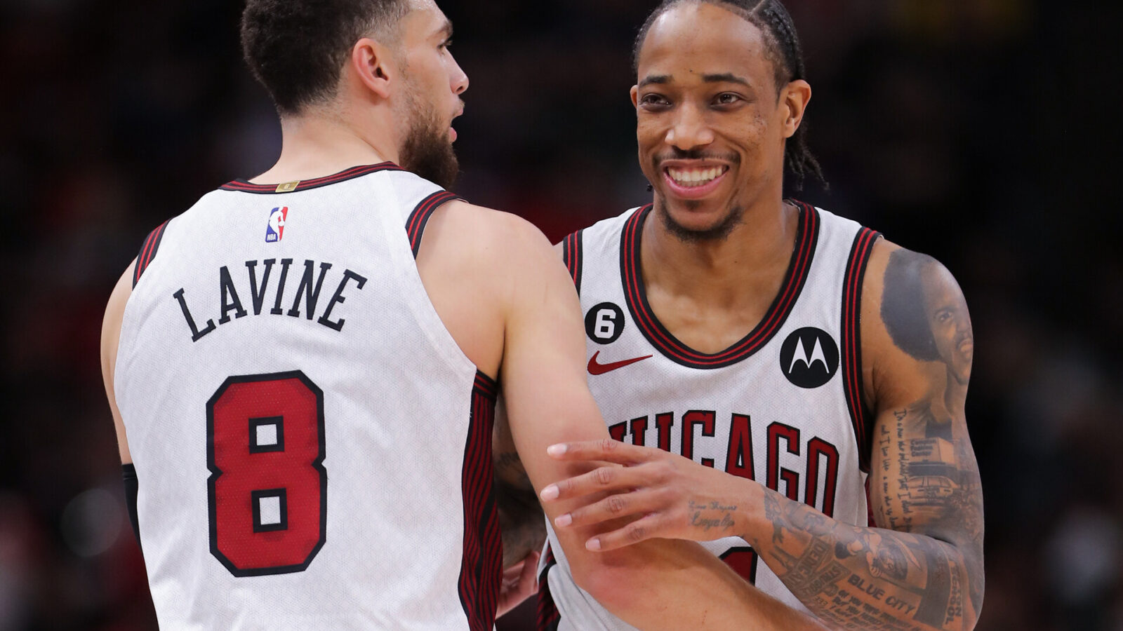 Chicago Bulls forward DeMar DeRozan (11) and Chicago Bulls guard Zach LaVine (8) chat during a NBA game between the Detroit Pistons and the Chicago Bulls on April 9, 2023 at the United Center in Chicago, IL.