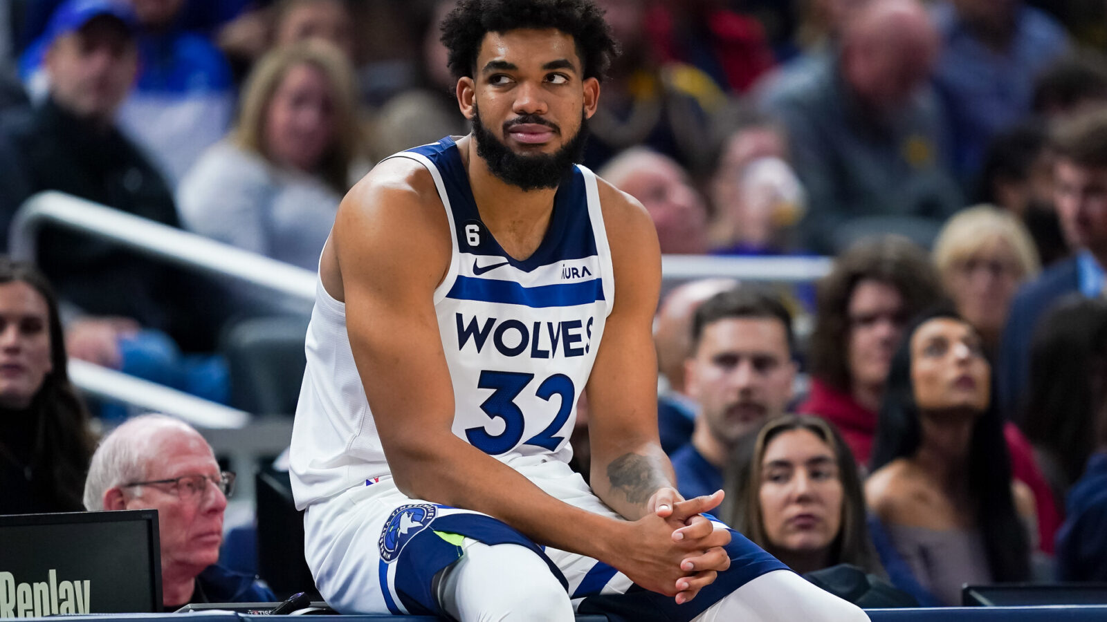Karl-Anthony Towns #32 of the Minnesota Timberwolves waits to enter the game in the second quarter against the Indiana Pacers at Gainbridge Fieldhouse on November 23, 2022 in Indianapolis, Indiana.