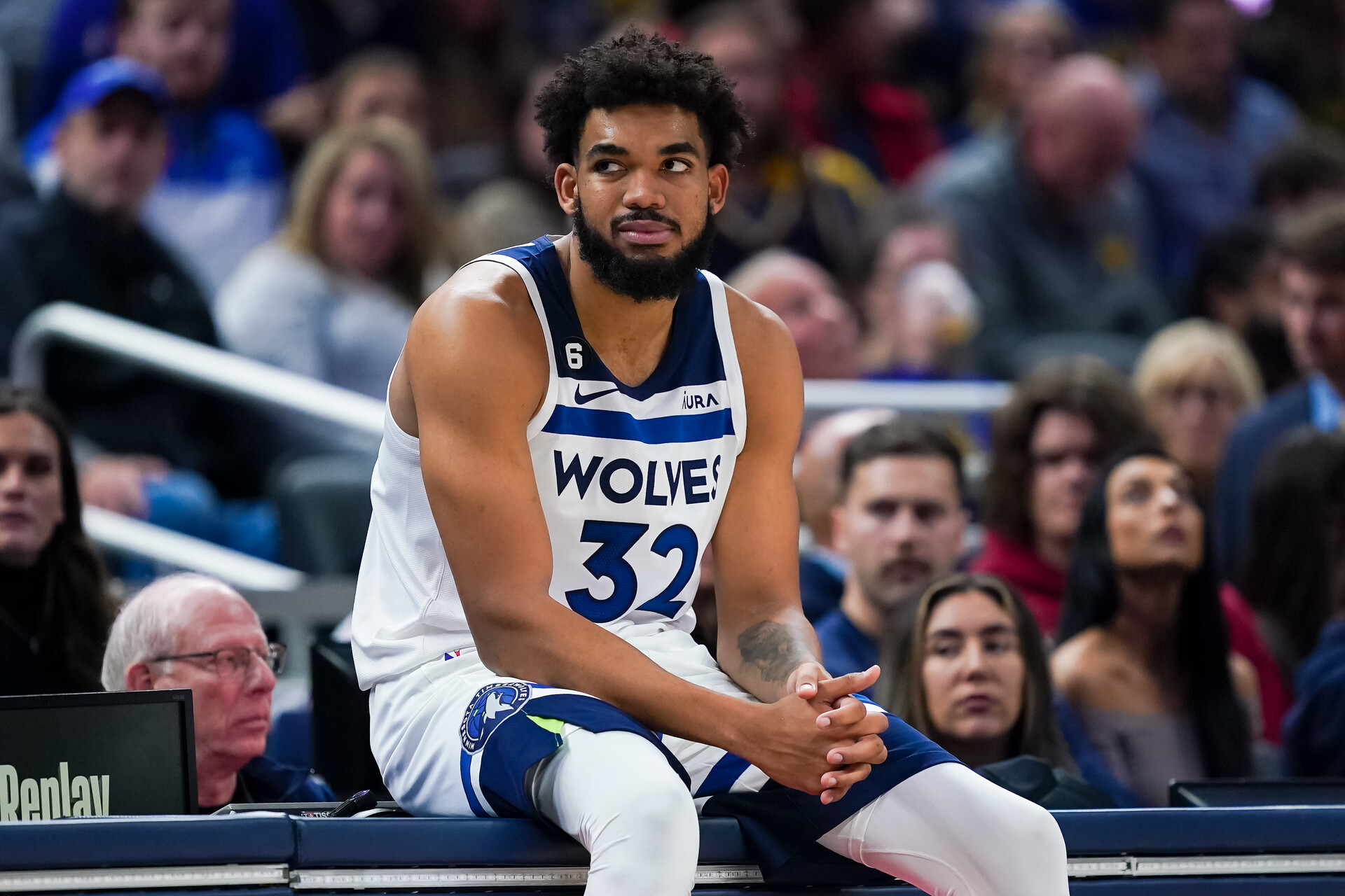 Karl-Anthony Towns #32 of the Minnesota Timberwolves waits to enter the game in the second quarter against the Indiana Pacers at Gainbridge Fieldhouse on November 23, 2022 in Indianapolis, Indiana.