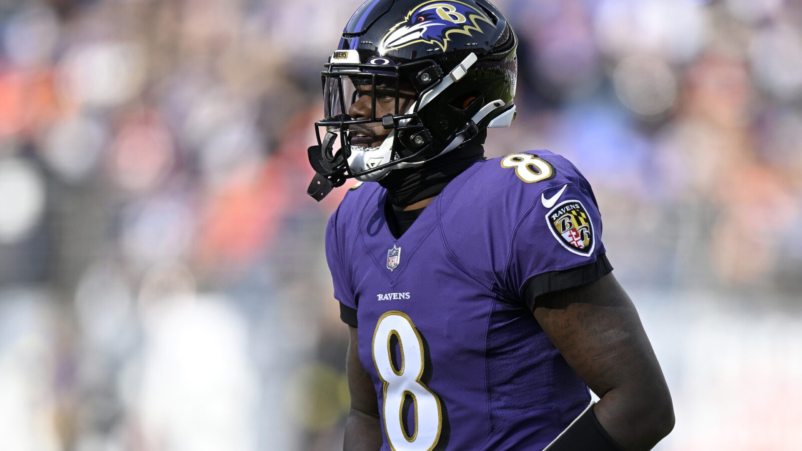 BALTIMORE, MARYLAND - DECEMBER 04: Lamar Jackson #8 of the Baltimore Ravens walks across the field during the game against the Denver Broncos at M&T Bank Stadium on December 04, 2022 in Baltimore, Maryland.