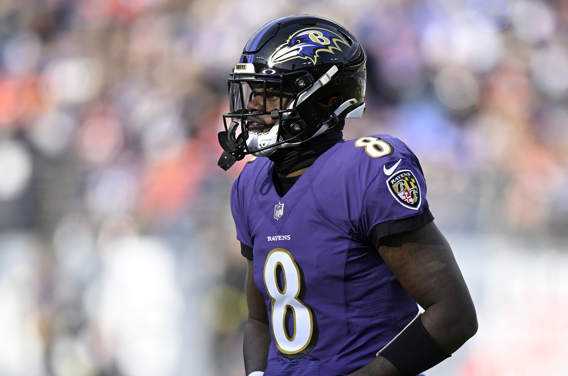 BALTIMORE, MARYLAND - DECEMBER 04: Lamar Jackson #8 of the Baltimore Ravens walks across the field during the game against the Denver Broncos at M&T Bank Stadium on December 04, 2022 in Baltimore, Maryland.