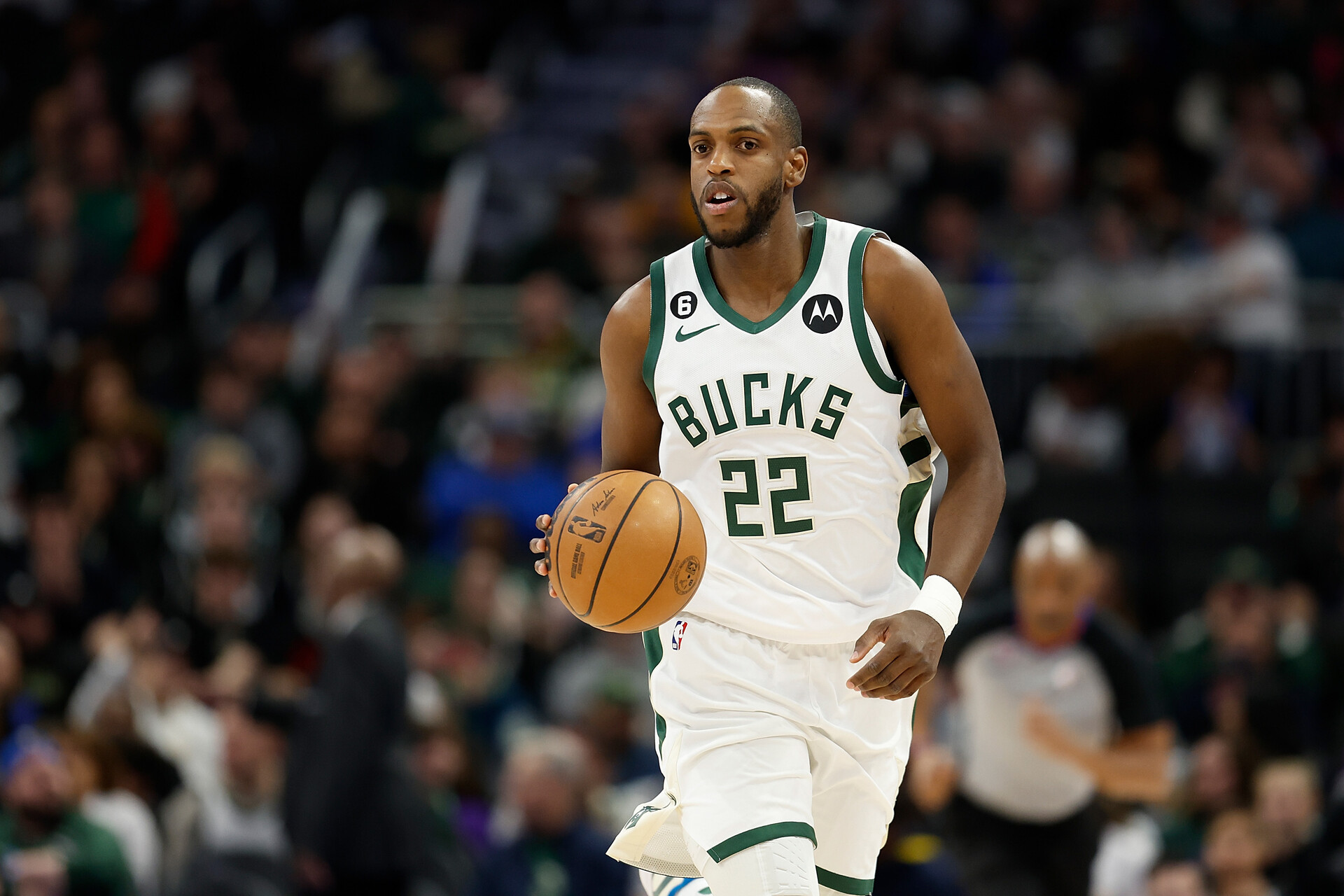 Khris Middleton #22 of the Milwaukee Bucks dribbles up court during the first half of the game against the Toronto Raptors at Fiserv Forum on March 19, 2023 in Milwaukee, Wisconsin.