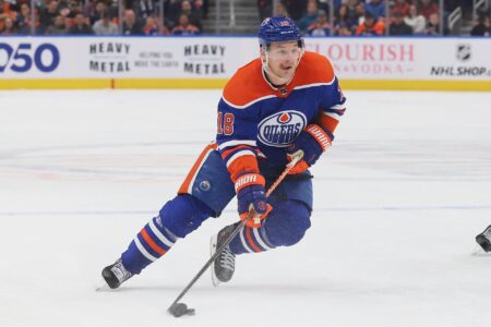 EDMONTON, CANADA - MARCH 22: Zach Hyman #18 of the Edmonton Oilers plays the puck in the second period against the Arizona Coyotes on March 22, 2023 at Rogers Place in Edmonton, Alberta, Canada. (Photo by