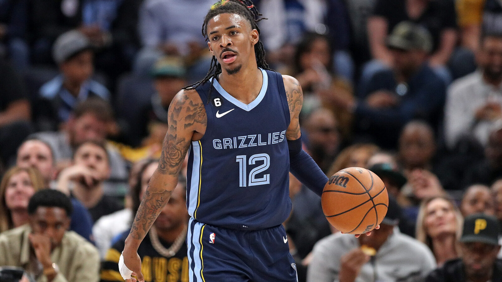 MEMPHIS, TENNESSEE - APRIL 16: Ja Morant #12 of the Memphis Grizzlies brings the ball up court during the game against the Los Angeles Lakers during Game One of the Western Conference First Round Playoffs at FedExForum on April 16, 2023 in Memphis, Tennessee. NOTE TO USER: User expressly acknowledges and agrees that, by downloading and or using this photograph, User is consenting to the terms and conditions of the Getty Images License Agreement.