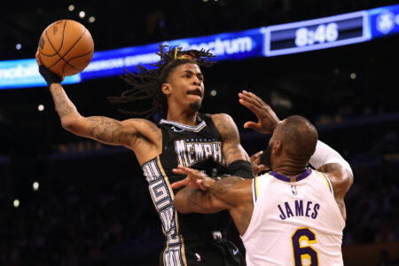 Ja Morant #12 of the Memphis Grizzlies drives to the basket on LeBron James #6 of the Los Angeles Lakers during 111-101 Lakers win in Game Three of the Western Conference First Round Playoffs at Crypto.com Arena on April 22, 2023 in Los Angeles, California.