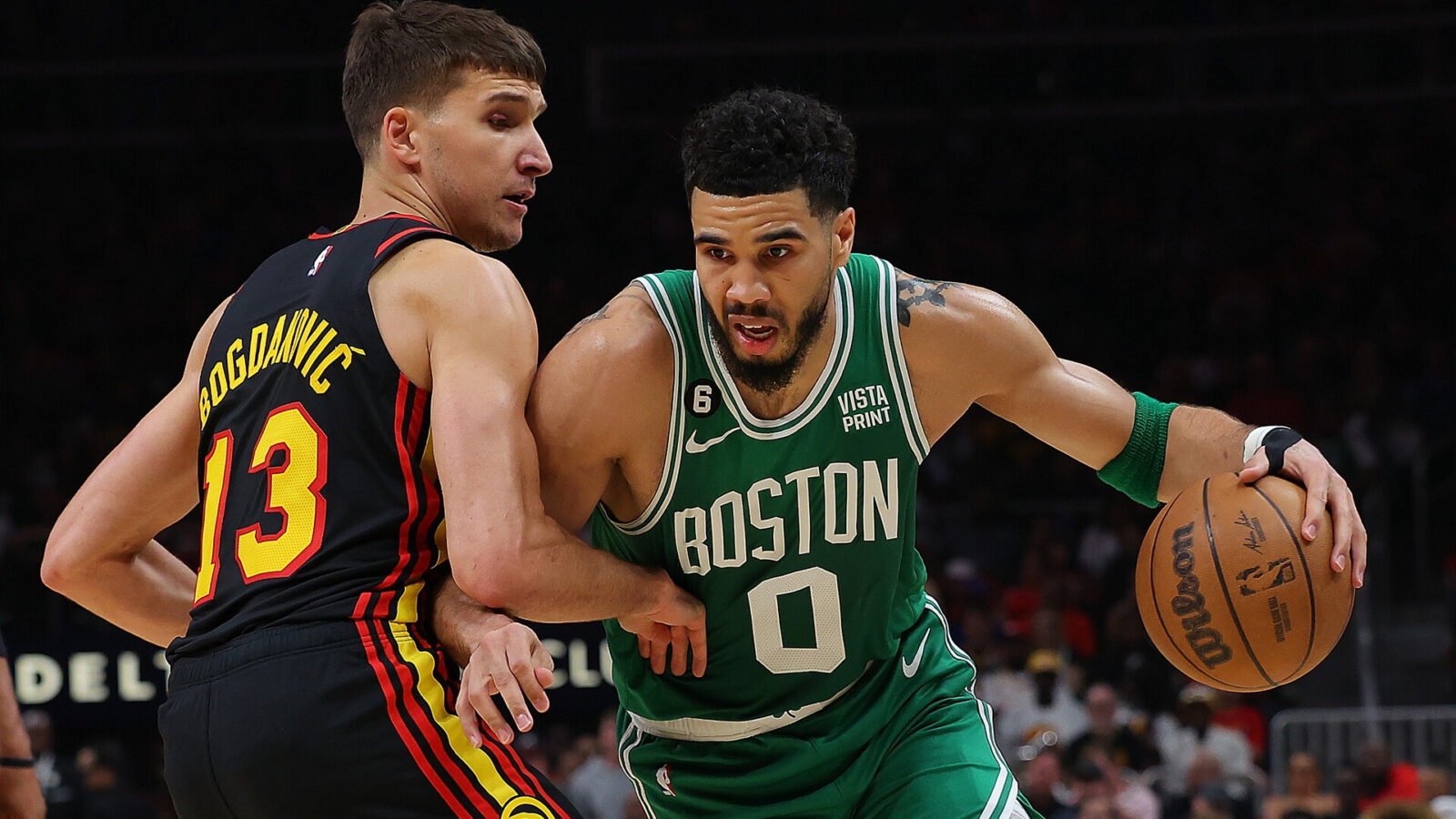Jayson Tatum #0 of the Boston Celtics drives against Bogdan Bogdanovic #13 of the Atlanta Hawks during the first quarter of Game Four of the Eastern Conference First Round Playoffs at State Farm Arena on April 23, 2023 in Atlanta, Georgia.