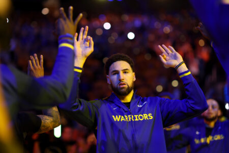 Klay Thompson #11 of the Golden State Warriors walks on to the court for player introductions before Game Four of the Western Conference First Round Playoffs against the Sacramento Kings at Chase Center on April 23, 2023 in San Francisco, California.