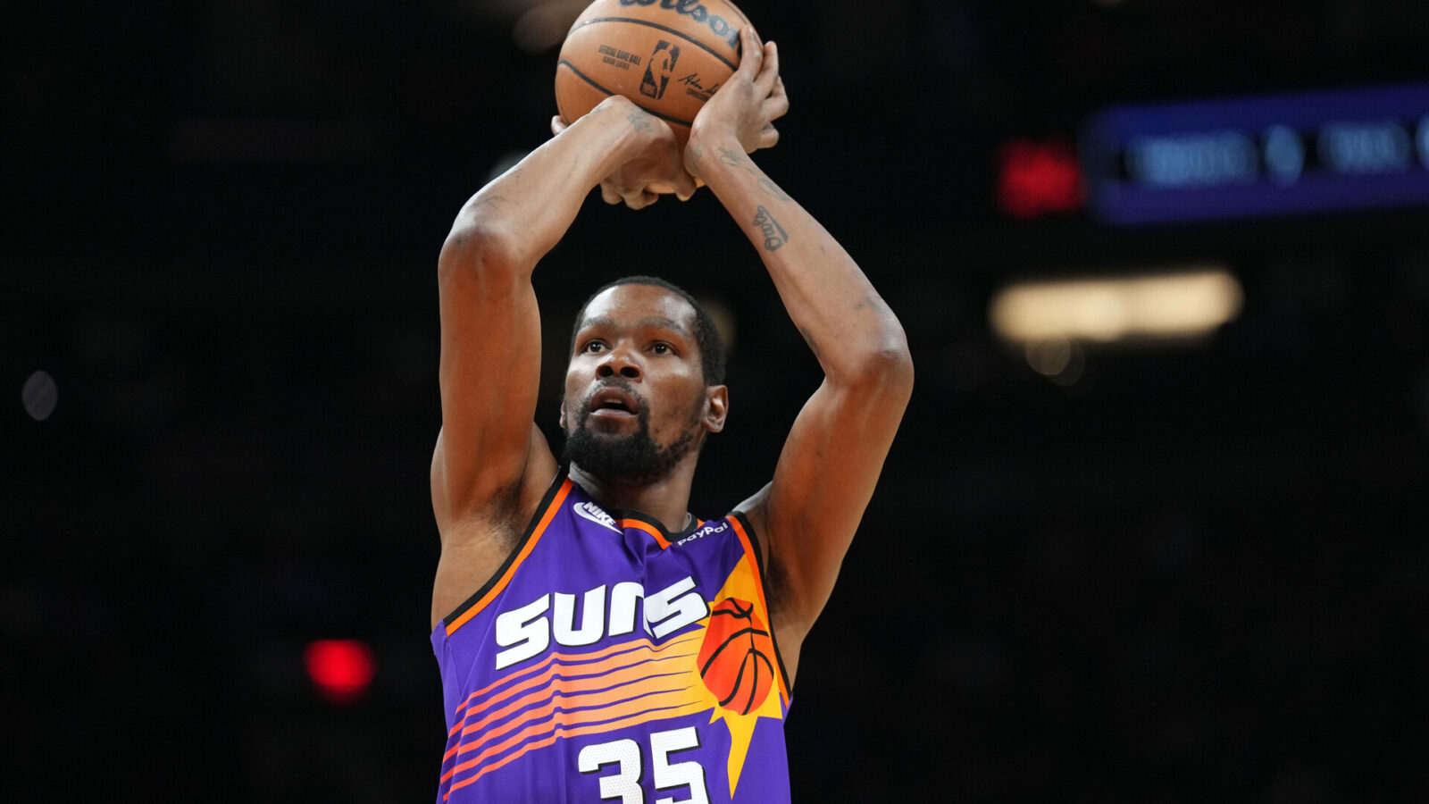 Phoenix Suns forward Kevin Durant (35) shoots against the Denver Nuggets during the first half at Footprint Center.