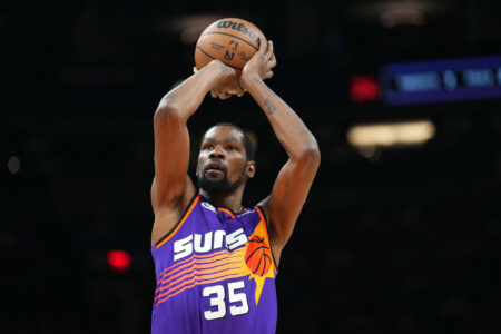 Phoenix Suns forward Kevin Durant (35) shoots against the Denver Nuggets during the first half at Footprint Center.