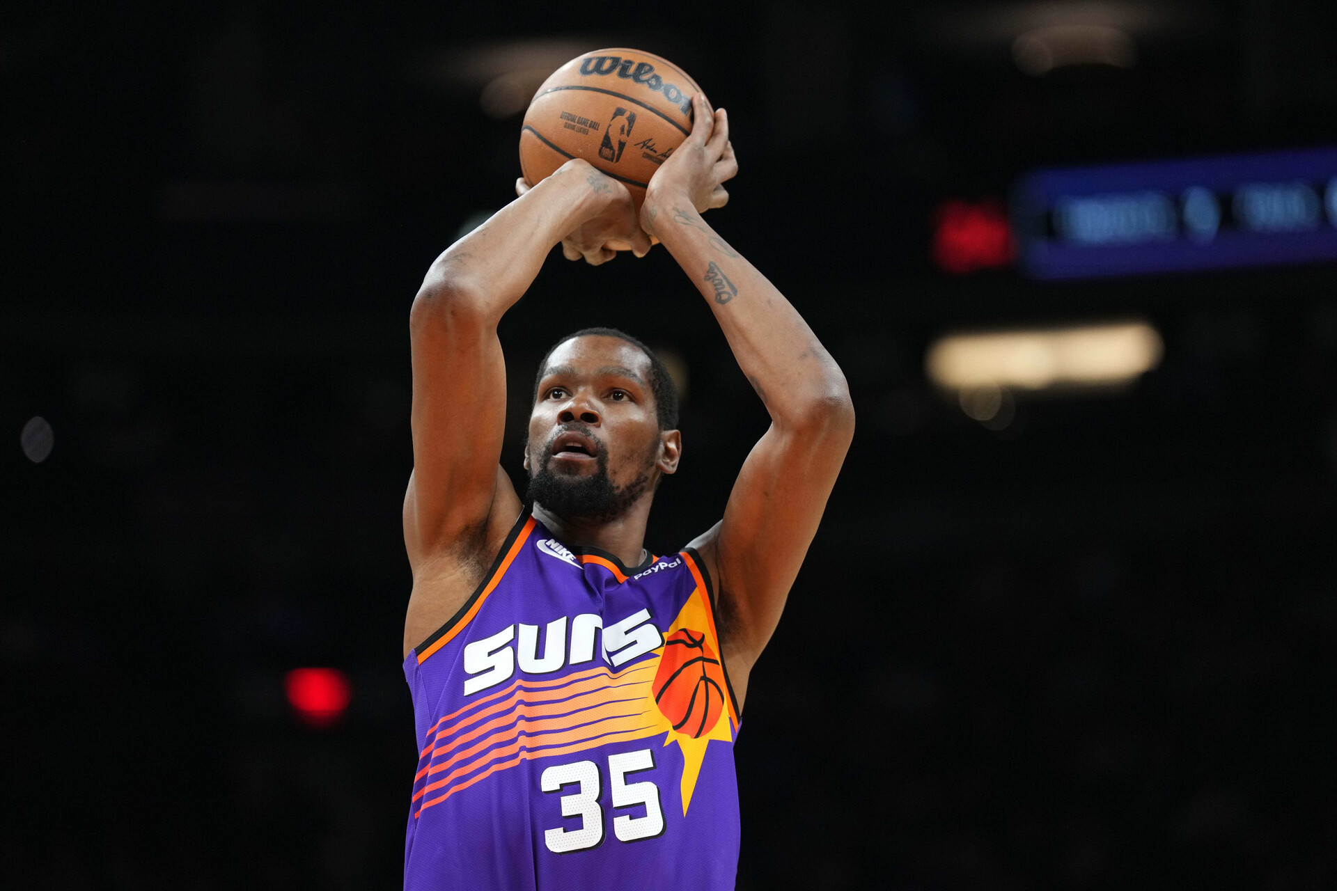 Phoenix Suns forward Kevin Durant (35) shoots against the Denver Nuggets during the first half at Footprint Center.
