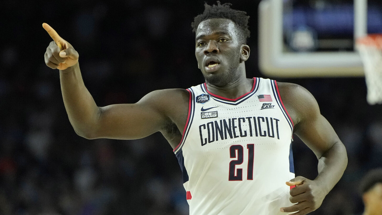 Connecticut Huskies forward Adama Sanogo (21) reacts after a play against the Miami (Fl) Hurricanes during the second half in the semifinals of the Final Four of the 2023 NCAA Tournament at NRG Stadium.
