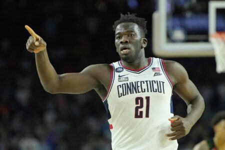 Connecticut Huskies forward Adama Sanogo (21) reacts after a play against the Miami (Fl) Hurricanes during the second half in the semifinals of the Final Four of the 2023 NCAA Tournament at NRG Stadium.