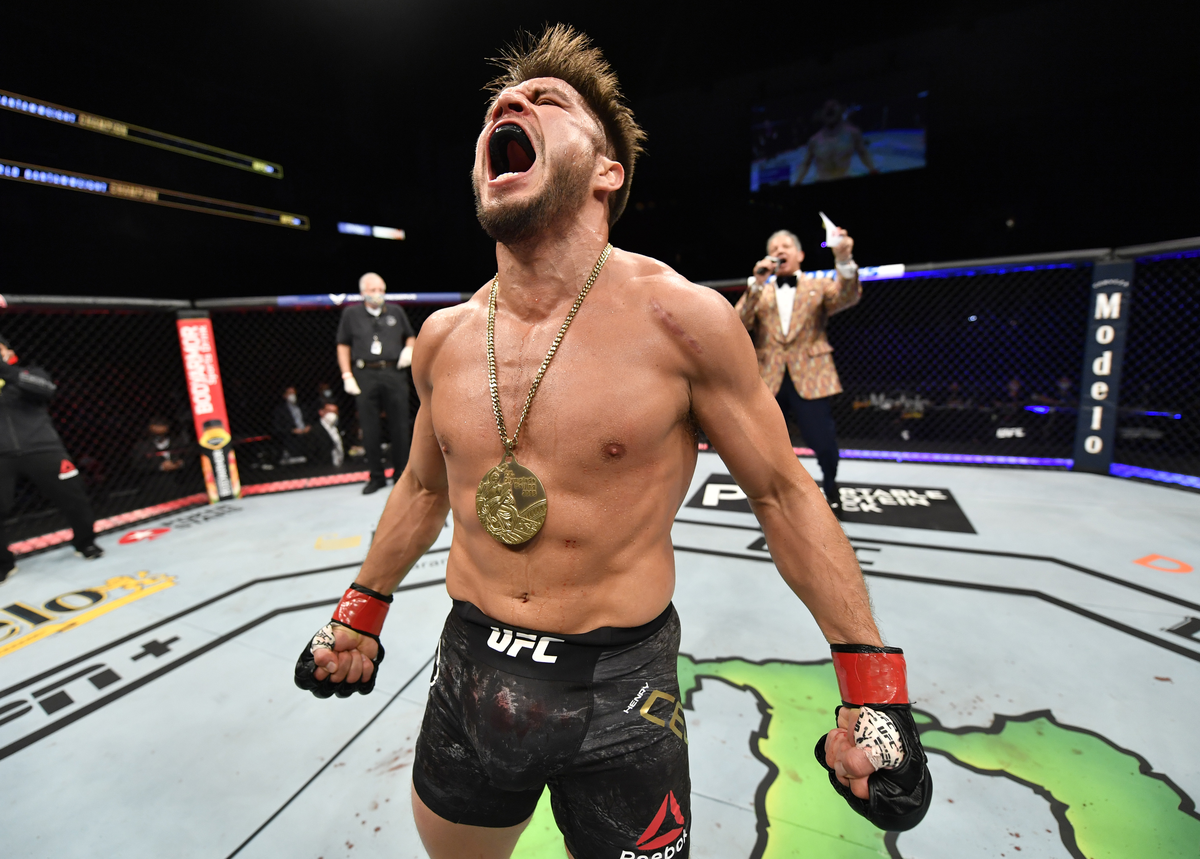 JACKSONVILLE, FLORIDA - MAY 09: Henry Cejudo celebrates after his knockout victory over Dominick Cruz in their UFC bantamweight championship fight during the UFC 249 event at VyStar Veterans Memorial Arena on May 09, 2020 in Jacksonville, Florida.