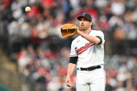 Shane Bieber #57 of the Cleveland Guardians looks on during the sixth inning against the New York Yankees at Progressive Field on April 10, 2023 in Cleveland, Ohio.