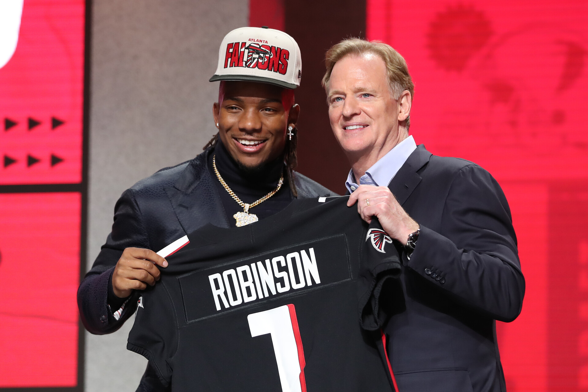 Texas running back Bijan Robinson holds a jersey with commission Roger Goodell after being drafted in the first round of the NFL Draft on April 27, 2023 at Union Station in Kansas City, MO.