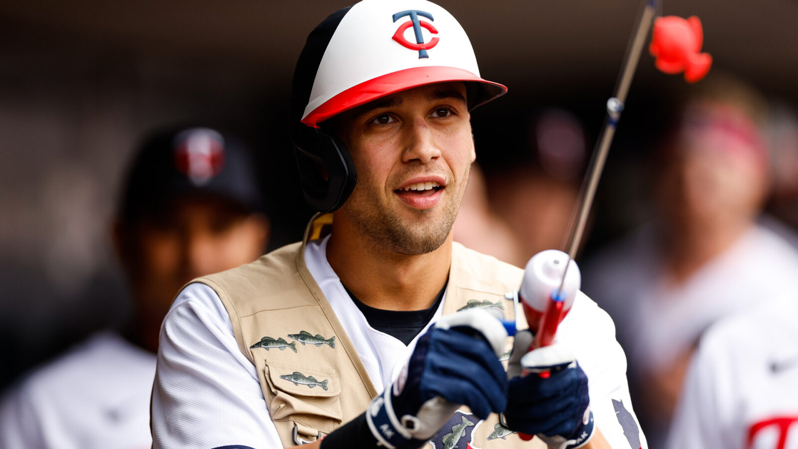 Alex Kirilloff #19 of the Minnesota Twins celebrates his solo home run for his second of the day with a celebratory fishing rod and vest in the third inning against the Chicago Cubs at Target Field on May 13, 2023 in Minneapolis, Minnesota. (