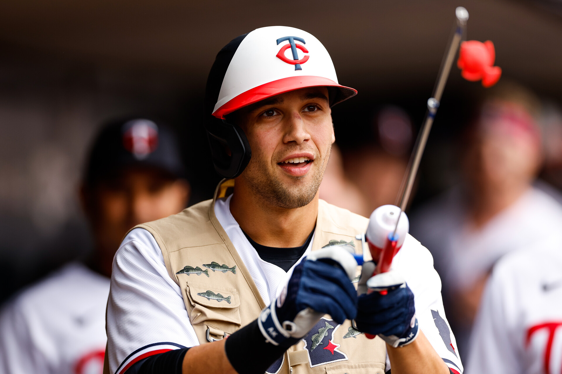 Alex Kirilloff #19 of the Minnesota Twins celebrates his solo home run for his second of the day with a celebratory fishing rod and vest in the third inning against the Chicago Cubs at Target Field on May 13, 2023 in Minneapolis, Minnesota. (