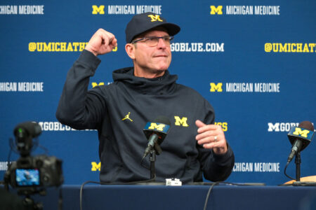 Head coach Jim Harbaugh of the Michigan Wolverines speaks to the media after the game against the Illinois Fighting Illini at Michigan Stadium on November 19, 2022 in Ann Arbor, Michigan. The Wolverines won 19-17.
