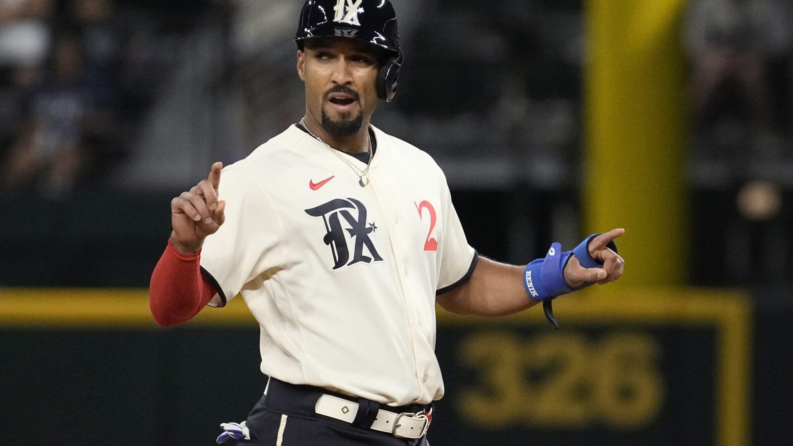 Marcus Semien #2 of the Texas Rangers stands on second base during the game against the Oakland Athletics at Globe Life Field on April 21, 2023 in Arlington, Texas.