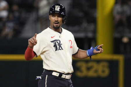 Marcus Semien #2 of the Texas Rangers stands on second base during the game against the Oakland Athletics at Globe Life Field on April 21, 2023 in Arlington, Texas.