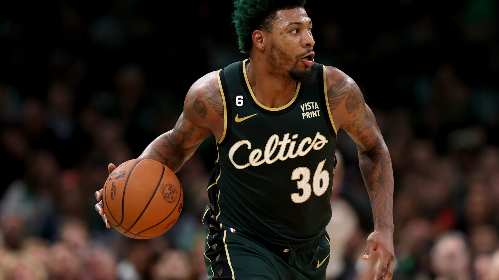 Marcus Smart #36 of the Boston Celtics dribbles against the Atlanta Hawks during the third quarter in game five of the Eastern Conference First Round Playoffs at TD Garden on April 25, 2023 in Boston, Massachusetts.
