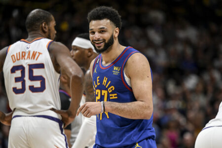Jamal Murray (27) of the Denver Nuggets smiles after drawing a hard foul from Chris Paul (3) of the Phoenix Suns in transition during the fourth quarter of Denvers 125-107 win at Ball Arena in Denver on Saturday, April 29, 2023. Denver took a 1-0 series lead in the best-of-seven Western Conference semifinal matchup.