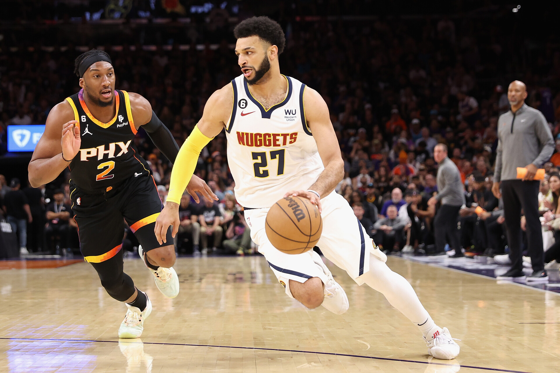Jamal Murray #27 of the Denver Nuggets drives the ball past Josh Okogie #2 of the Phoenix Suns during Game Four of the NBA Western Conference Semifinals at Footprint Center on May 07, 2023 in Phoenix, Arizona. The Suns defeated the Nuggets 129-124.