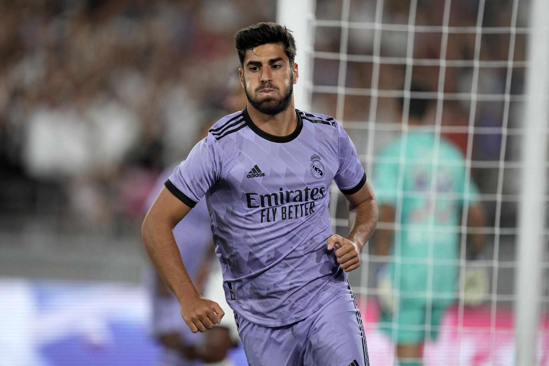 Pasadena California, USA; Real Madrid midfielder Marco Asensio (11) reacts after scoring a goal against Juventus in the second half during an international friendly at the Rose Bowl.