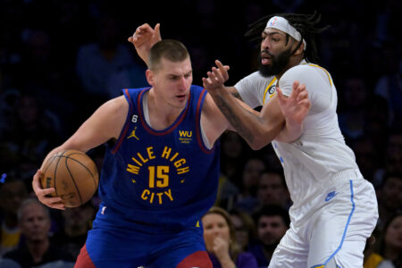 Denver Nuggets center Nikola Jokic (15) is guarded by Los Angeles Lakers forward Anthony Davis (3) in the second half at Crypto.com Arena. Mandatory Credit: