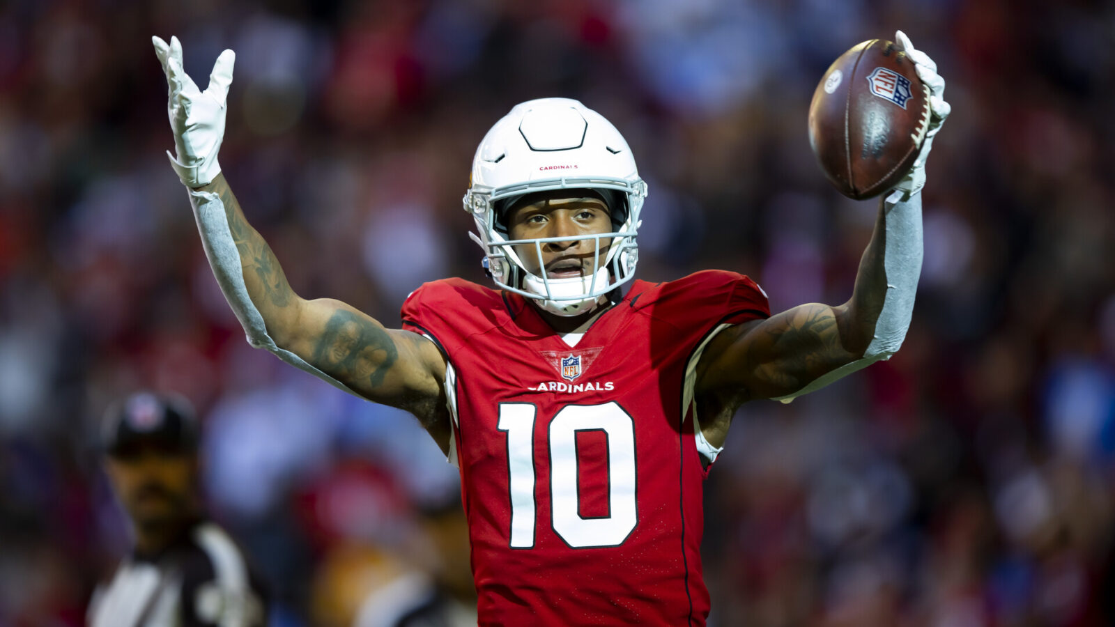 Arizona Cardinals wide receiver DeAndre Hopkins (10) celebrates after scoring a touchdown against the Los Angeles Chargers in the first half at State Farm Stadium.