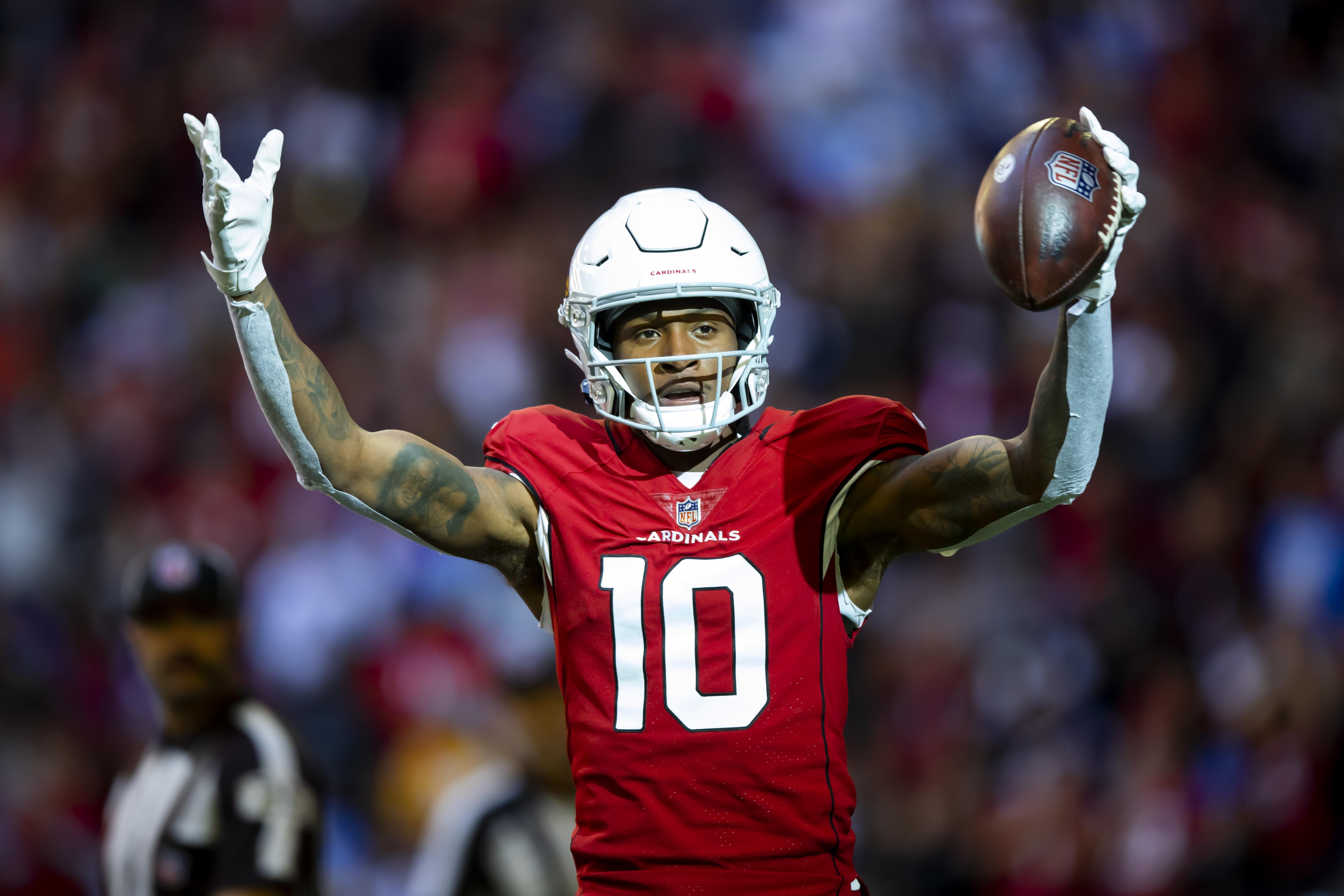 Arizona Cardinals wide receiver DeAndre Hopkins (10) celebrates after scoring a touchdown against the Los Angeles Chargers in the first half at State Farm Stadium.