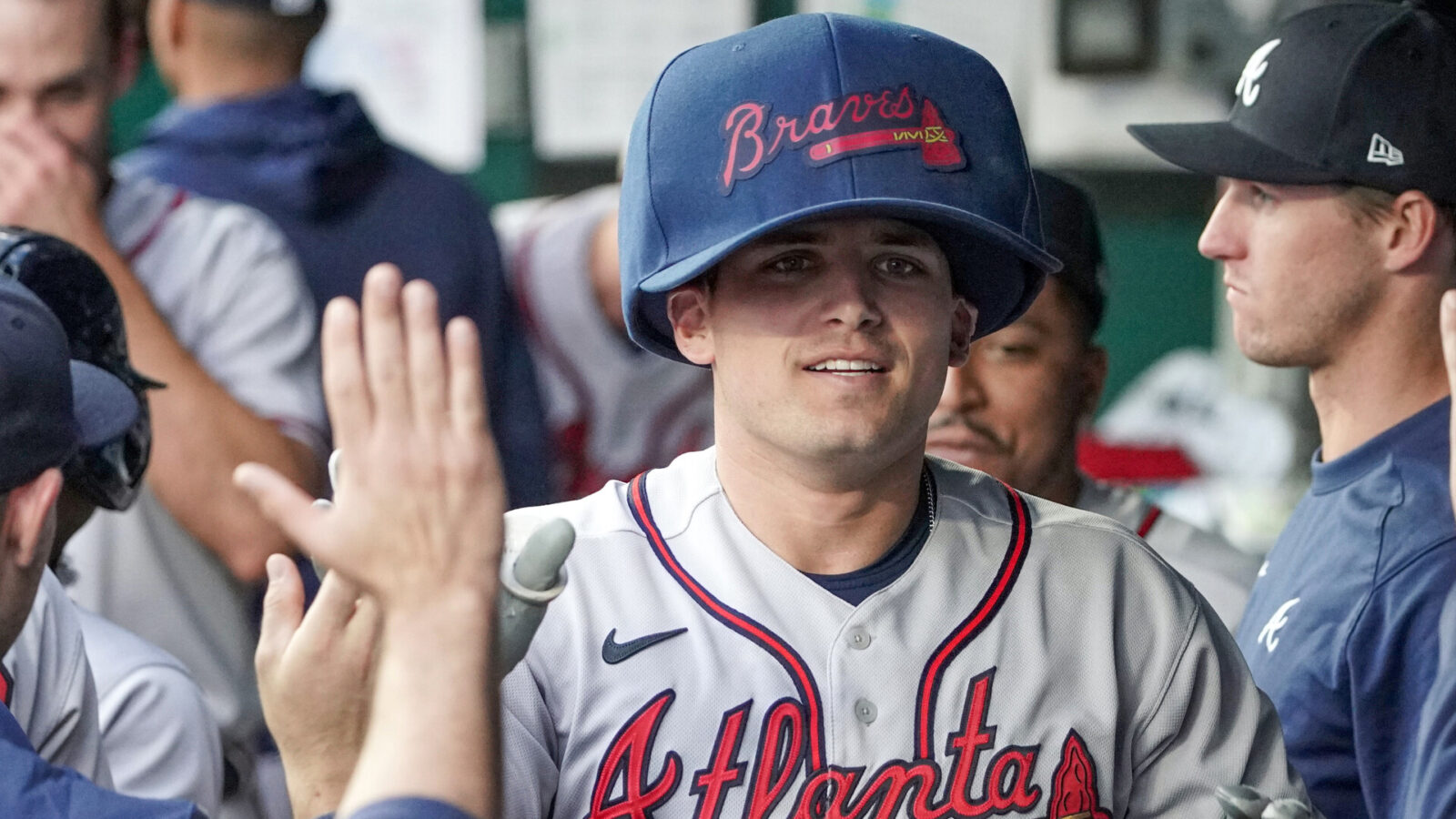 Atlanta Braves third baseman Austin Riley (27) celebrates in the dugout after hitting a home run against the Kansas City Royals in the first inning at Kauffman Stadium.