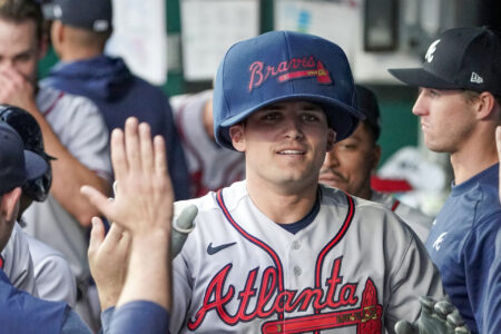 Atlanta Braves third baseman Austin Riley (27) celebrates in the dugout after hitting a home run against the Kansas City Royals in the first inning at Kauffman Stadium.