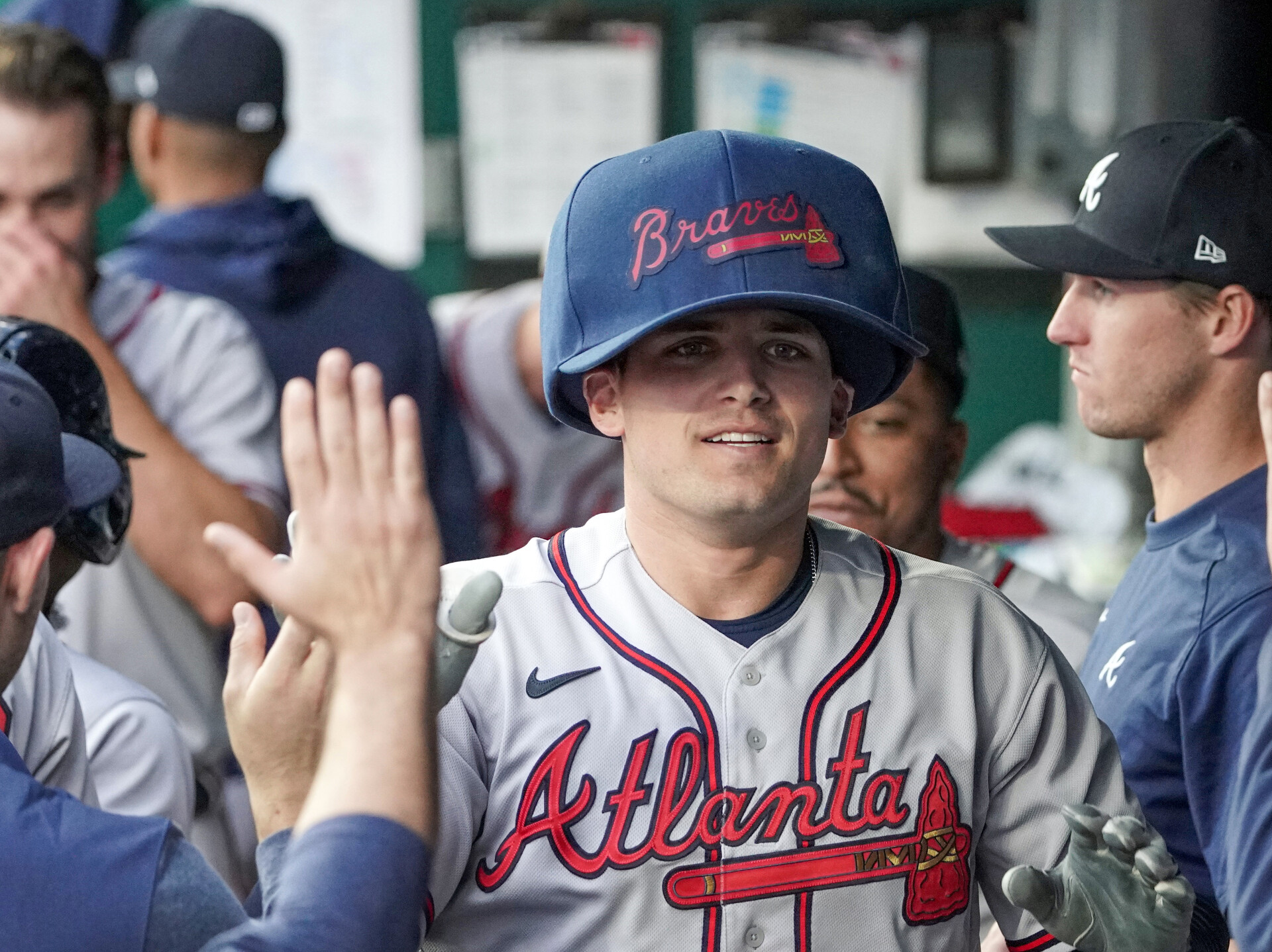 Atlanta Braves third baseman Austin Riley (27) celebrates in the dugout after hitting a home run against the Kansas City Royals in the first inning at Kauffman Stadium.