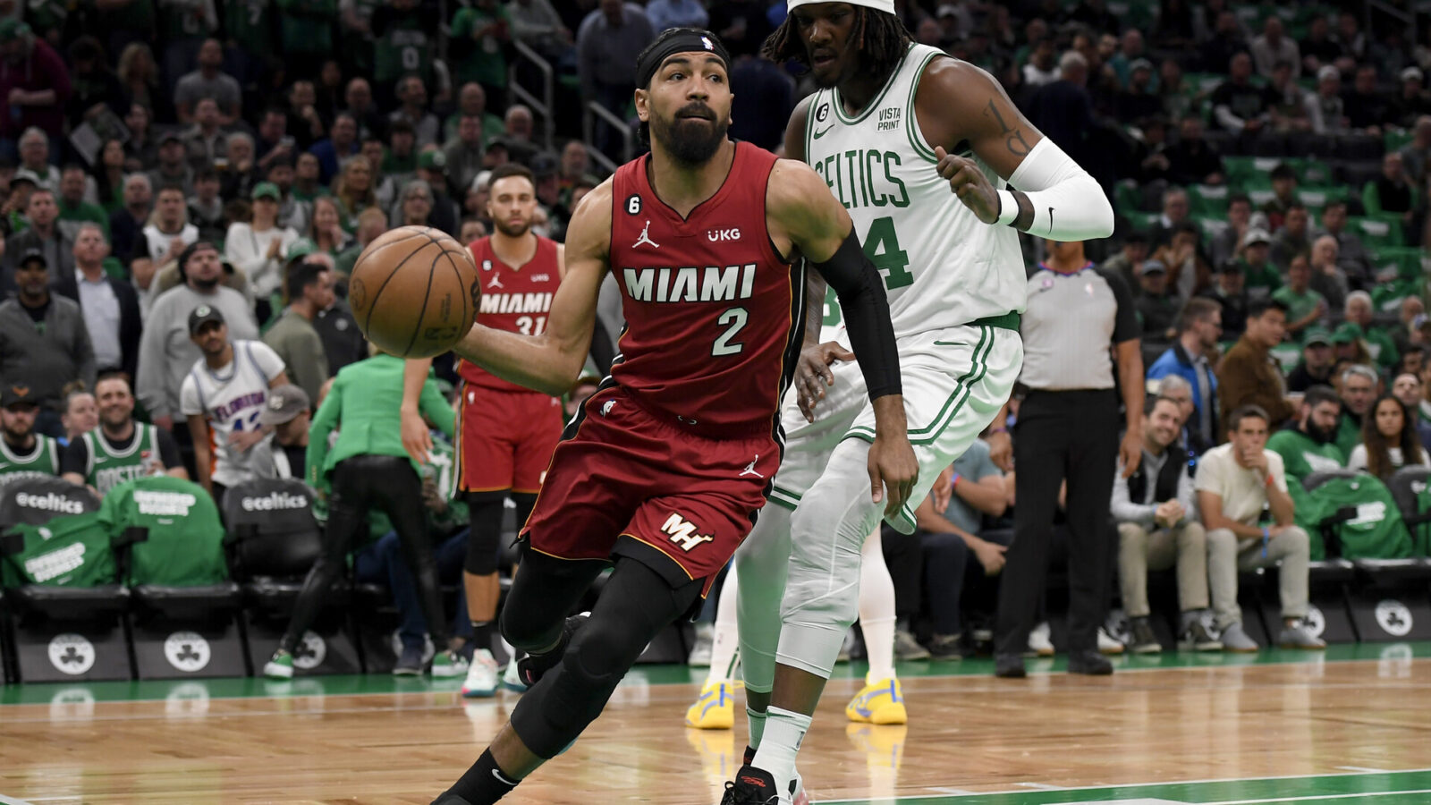 May 17, 2023; Boston, Massachusetts, USA; Miami Heat guard Gabe Vincent (2) dribbles against Boston Celtics center Robert Williams III (44) during the first quarter in game one of the Eastern Conference Finals for the 2023 NBA playoffs at TD Garden.