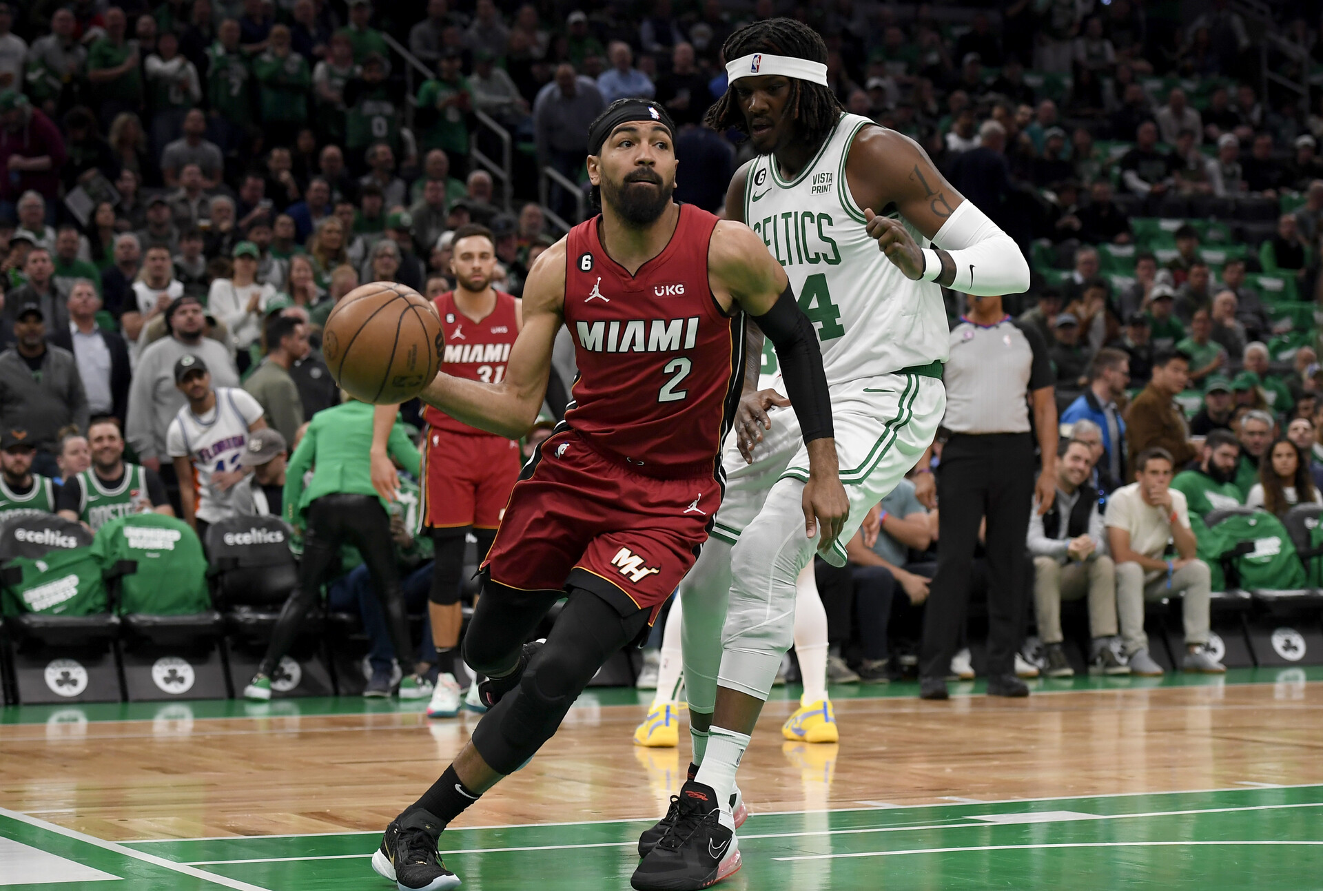 May 17, 2023; Boston, Massachusetts, USA; Miami Heat guard Gabe Vincent (2) dribbles against Boston Celtics center Robert Williams III (44) during the first quarter in game one of the Eastern Conference Finals for the 2023 NBA playoffs at TD Garden.