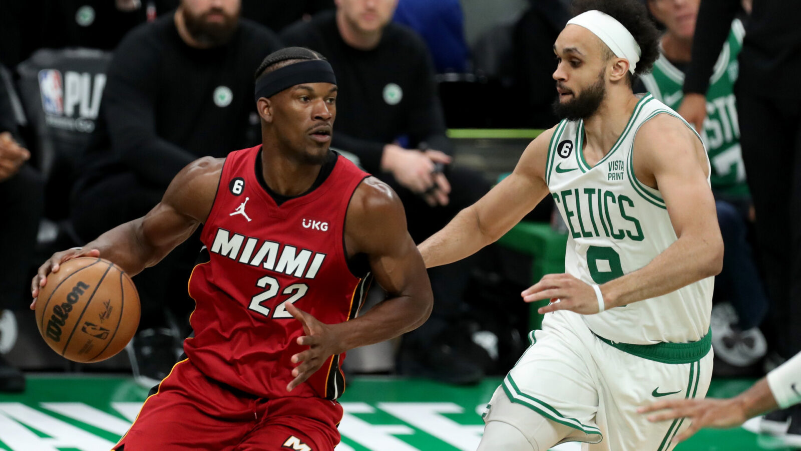 May 17, 2023; Boston, Massachusetts, USA; Miami Heat forward Jimmy Butler (22) dribbles against Boston Celtics guard Derrick White (9) during the second half in game one of the Eastern Conference Finals for the 2023 NBA playoffs at TD Garden.