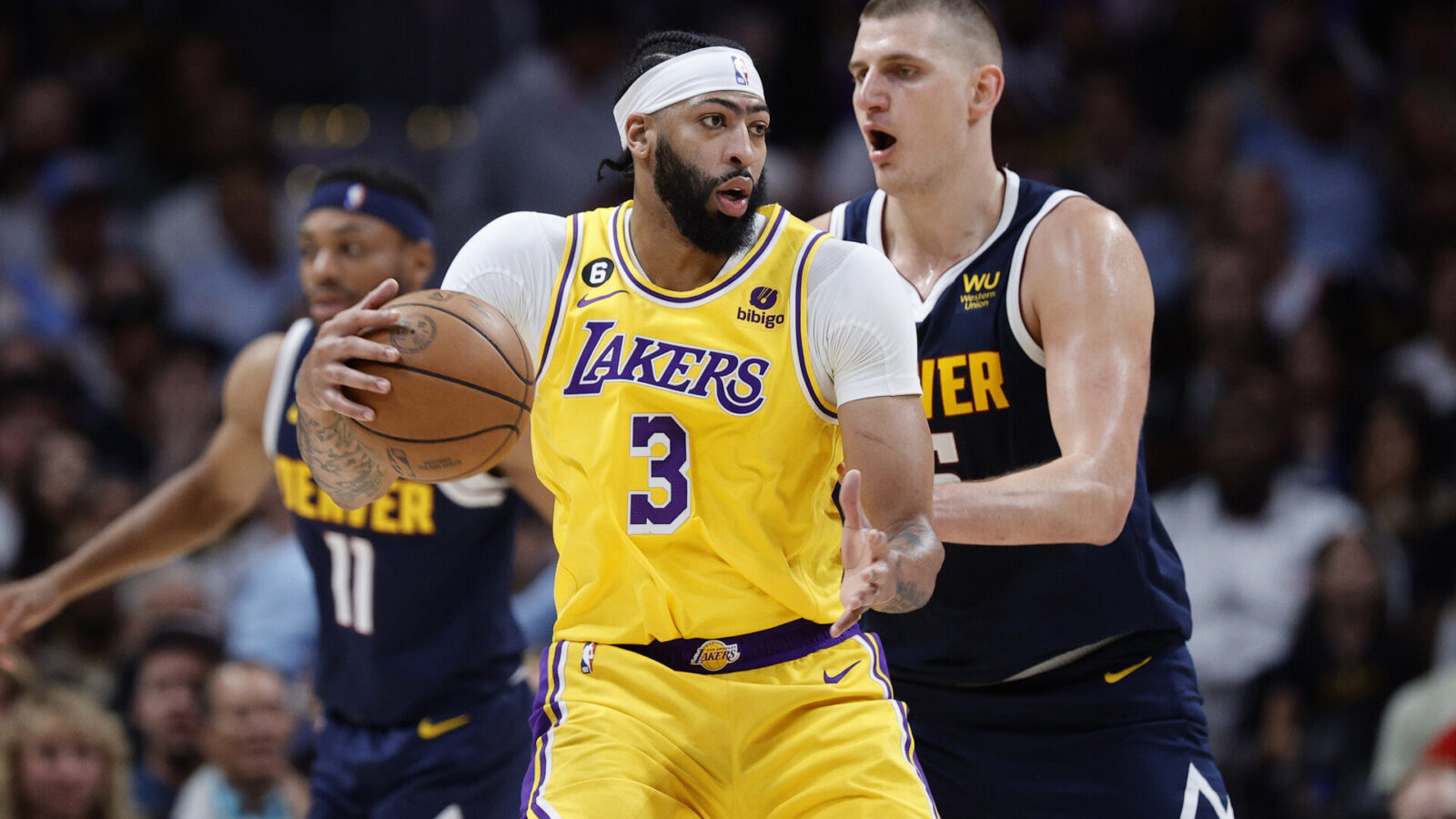 Los Angeles Lakers forward Anthony Davis (3) controls the ball against Denver Nuggets center Nikola Jokic (15) in the second quarter during game two of the Western Conference Finals for the 2023 NBA playoffs at Ball Arena.