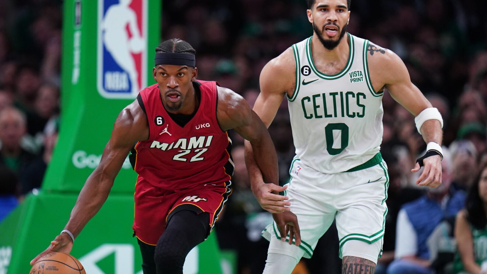 Miami Heat forward Jimmy Butler (22) dribbles against Boston Celtics forward Jayson Tatum (0) during the second half of game two of the Eastern Conference Finals for the 2023 NBA playoffs at TD Garden.