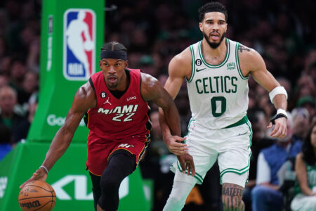 Miami Heat forward Jimmy Butler (22) dribbles against Boston Celtics forward Jayson Tatum (0) during the second half of game two of the Eastern Conference Finals for the 2023 NBA playoffs at TD Garden.