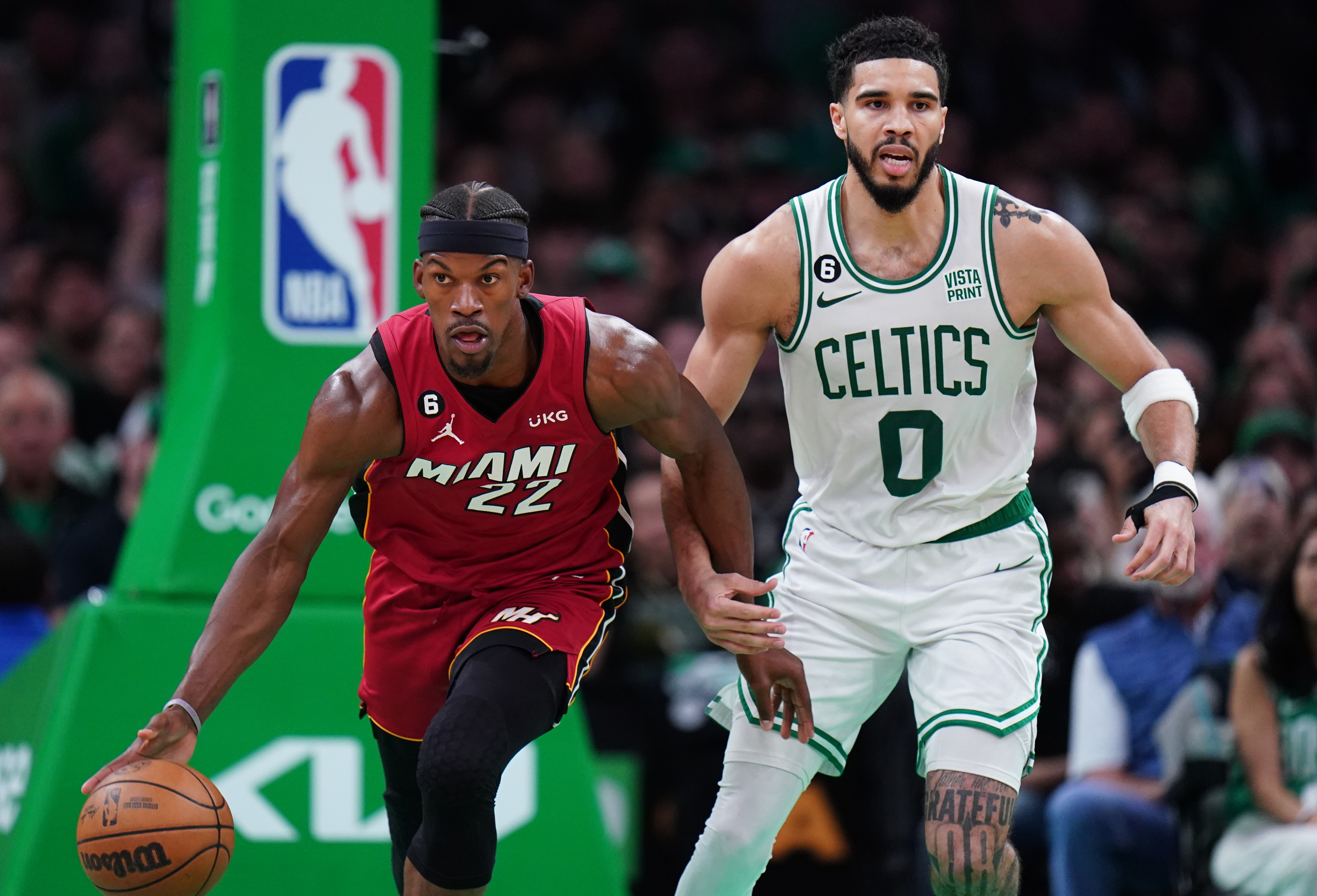 Miami Heat forward Jimmy Butler (22) dribbles against Boston Celtics forward Jayson Tatum (0) during the second half of game two of the Eastern Conference Finals for the 2023 NBA playoffs at TD Garden.