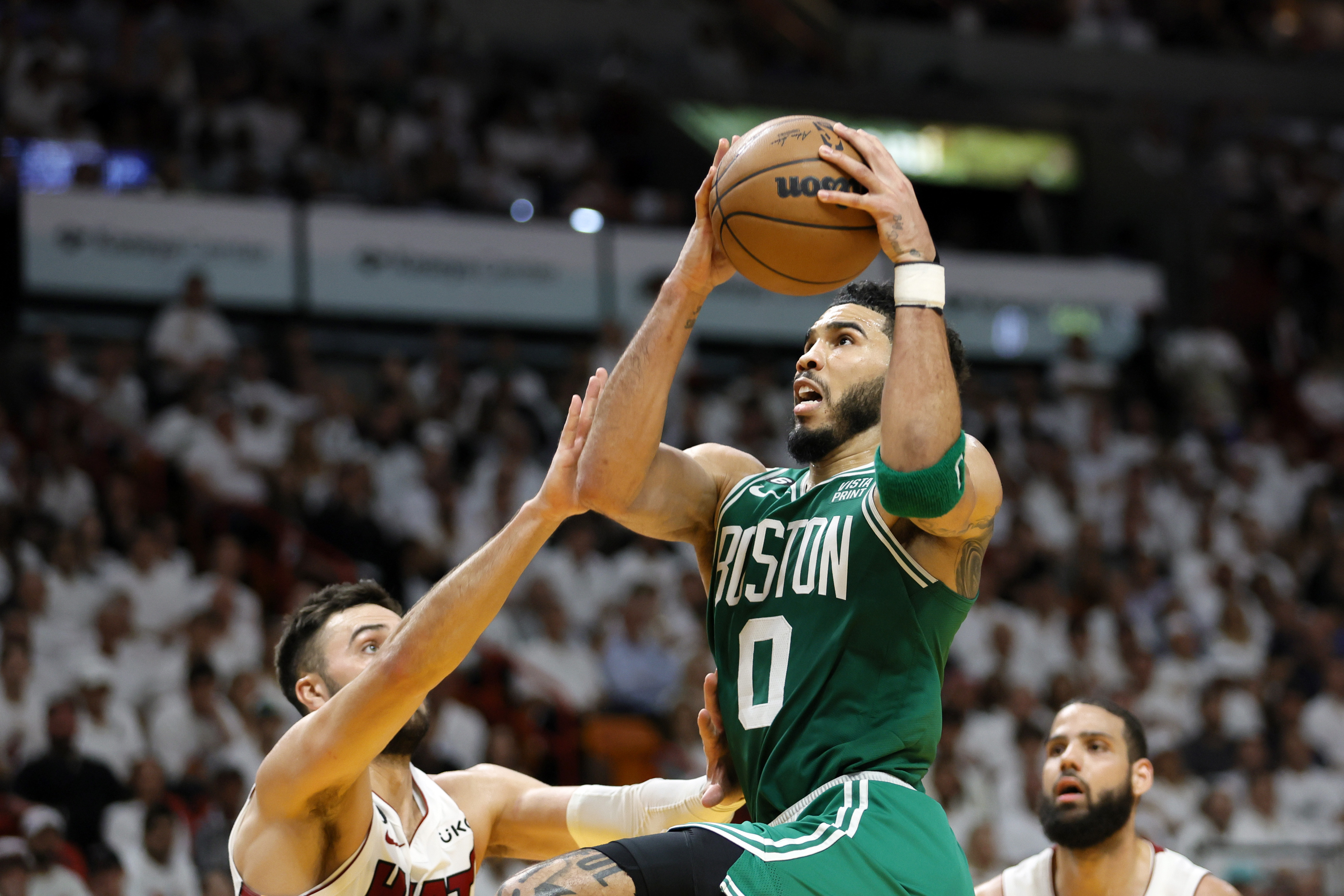 Boston Celtics forward Jayson Tatum (0) shoots against Miami Heat guard Max Strus (31) in the third quarter during game four of the Eastern Conference Finals for the 2023 NBA playoffs at Kaseya Center.